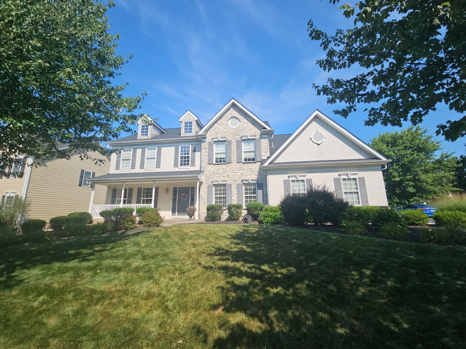 Original stucco and stone home exterior